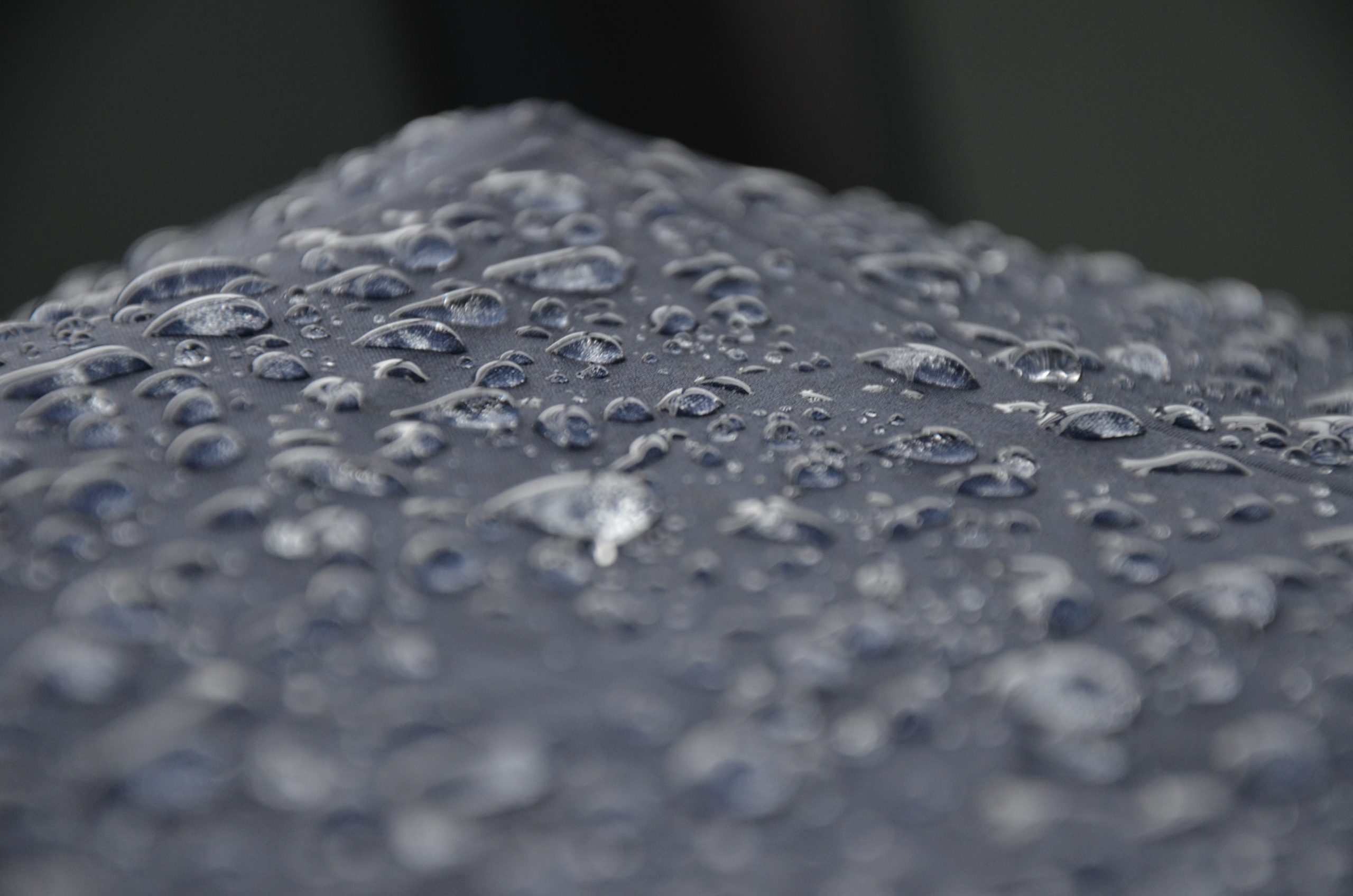 Water droplets on a grey surface